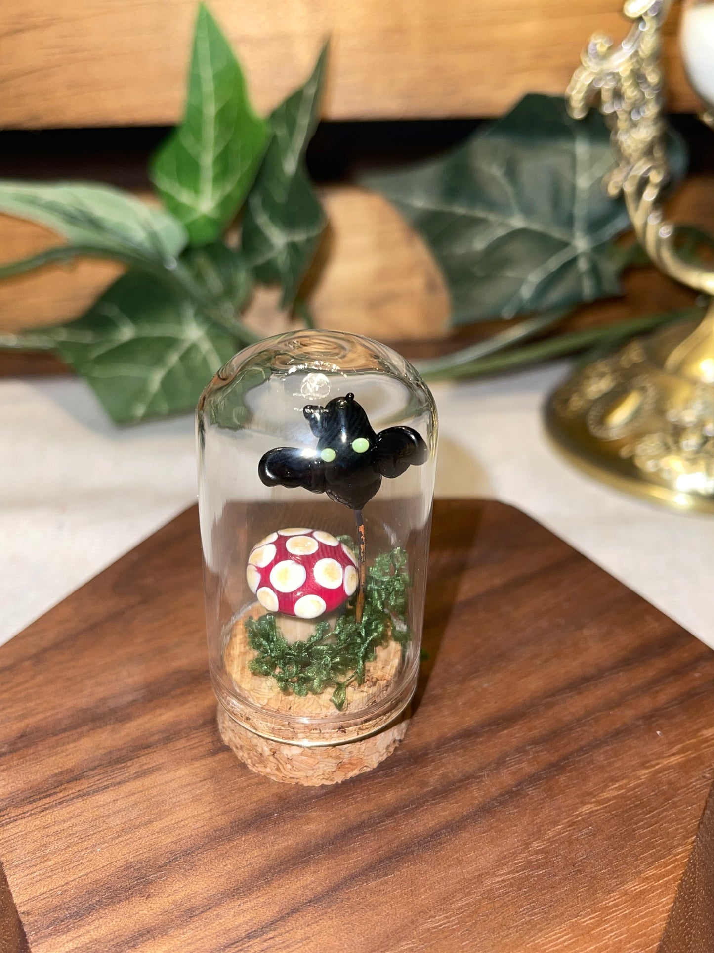 Glass Mushroom and Glass Bat under a Glass Dome