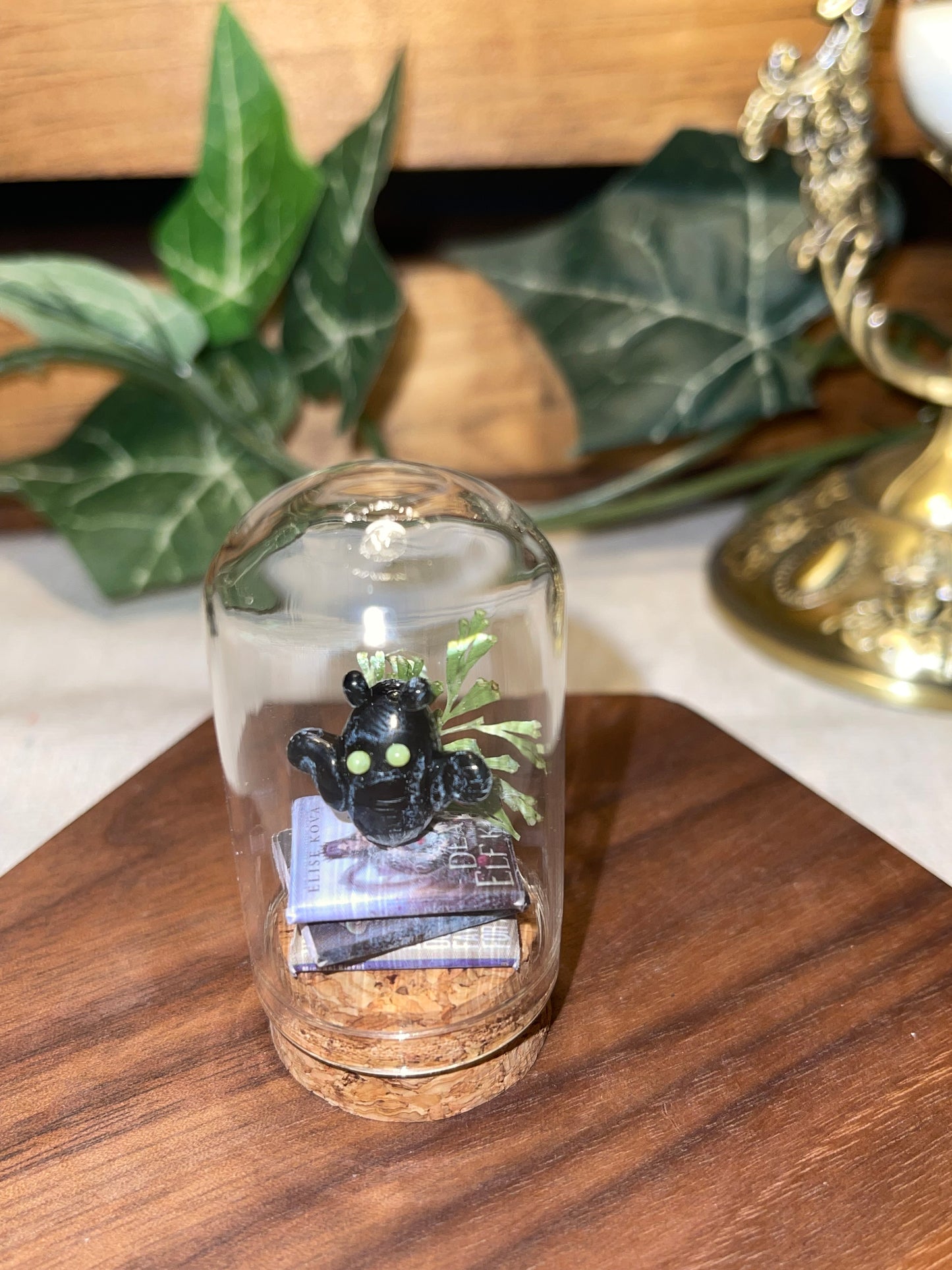 Glass Bat on a Stack of Books