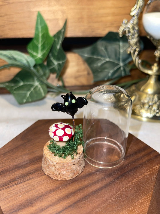 Glass Mushroom and Glass Bat under a Glass Dome